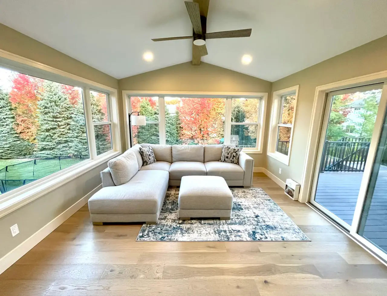 A vaulted sunroom living space completed by DNA Builders